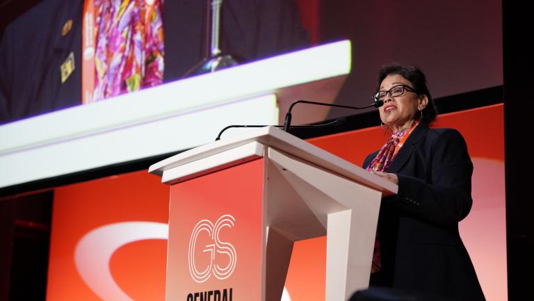 CITES Secretary-General Ivonne Higuero at podium, WOAH 90th general session opening remarks
