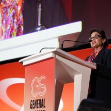 CITES Secretary-General Ivonne Higuero at podium, WOAH 90th general session opening remarks